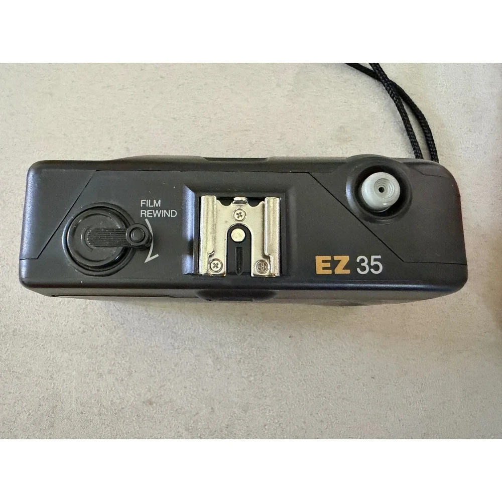 Vivitar EZ 35 35mm Film Camera with Sylvania Flip Flash Super 10 Two Pack Black
